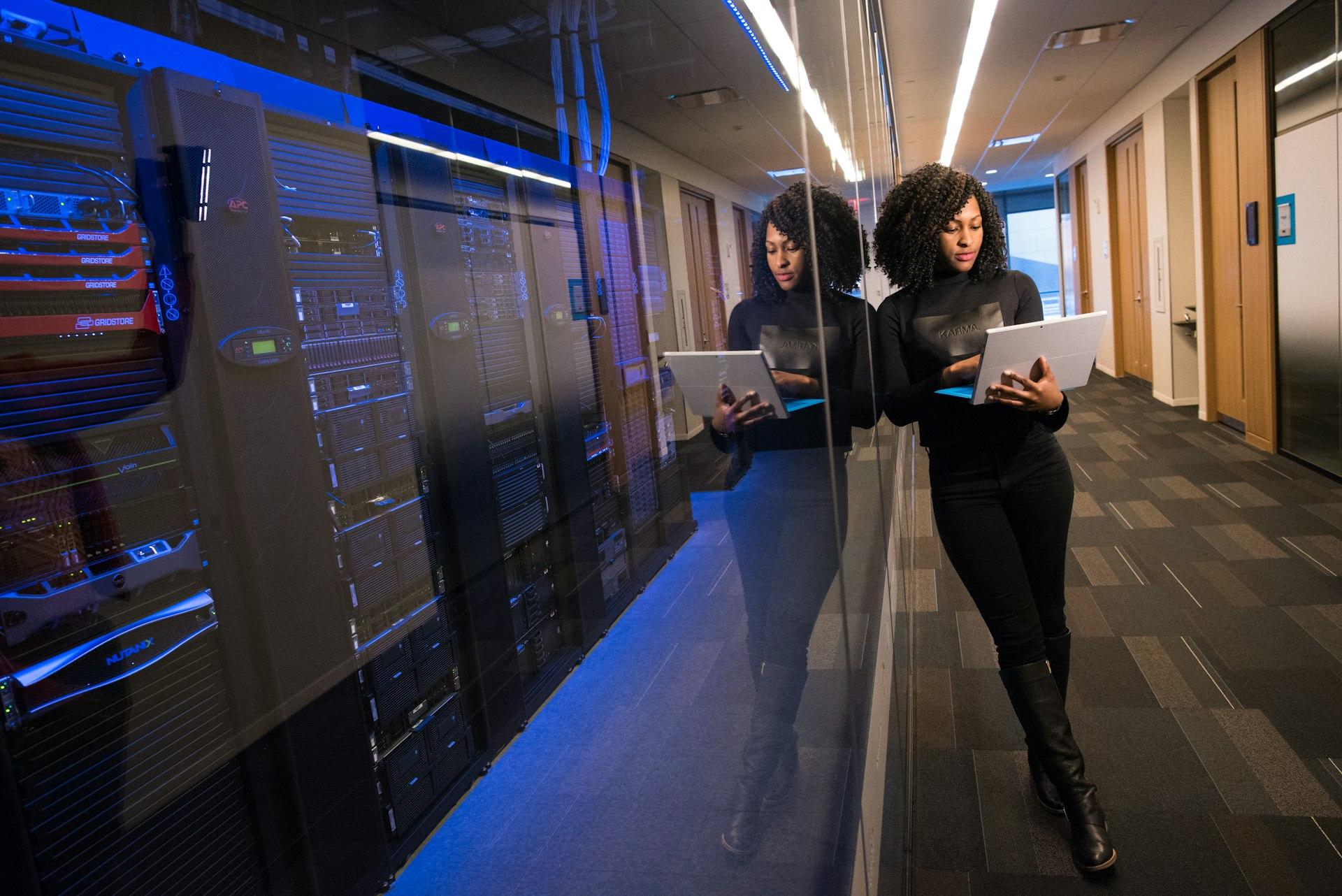 An engineer working across multiple screens